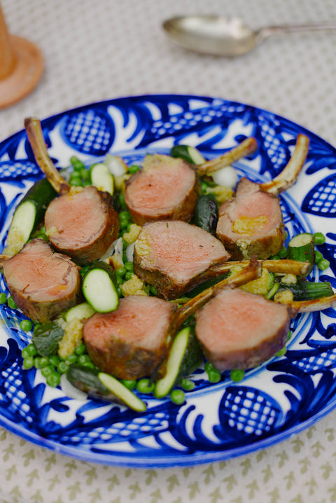 Herb-Marinated Lamb Rack with Charred Peas, Baby Courgettes, Spring Onion & Preserved Lemon Dressing